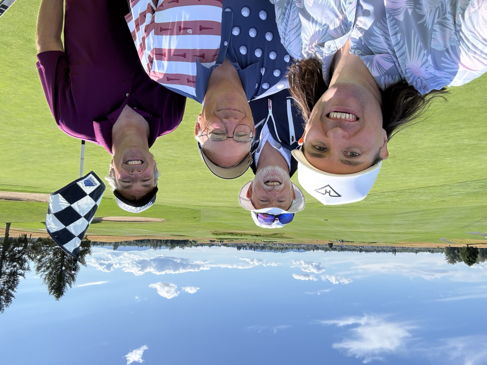 The foursome on a links-style green